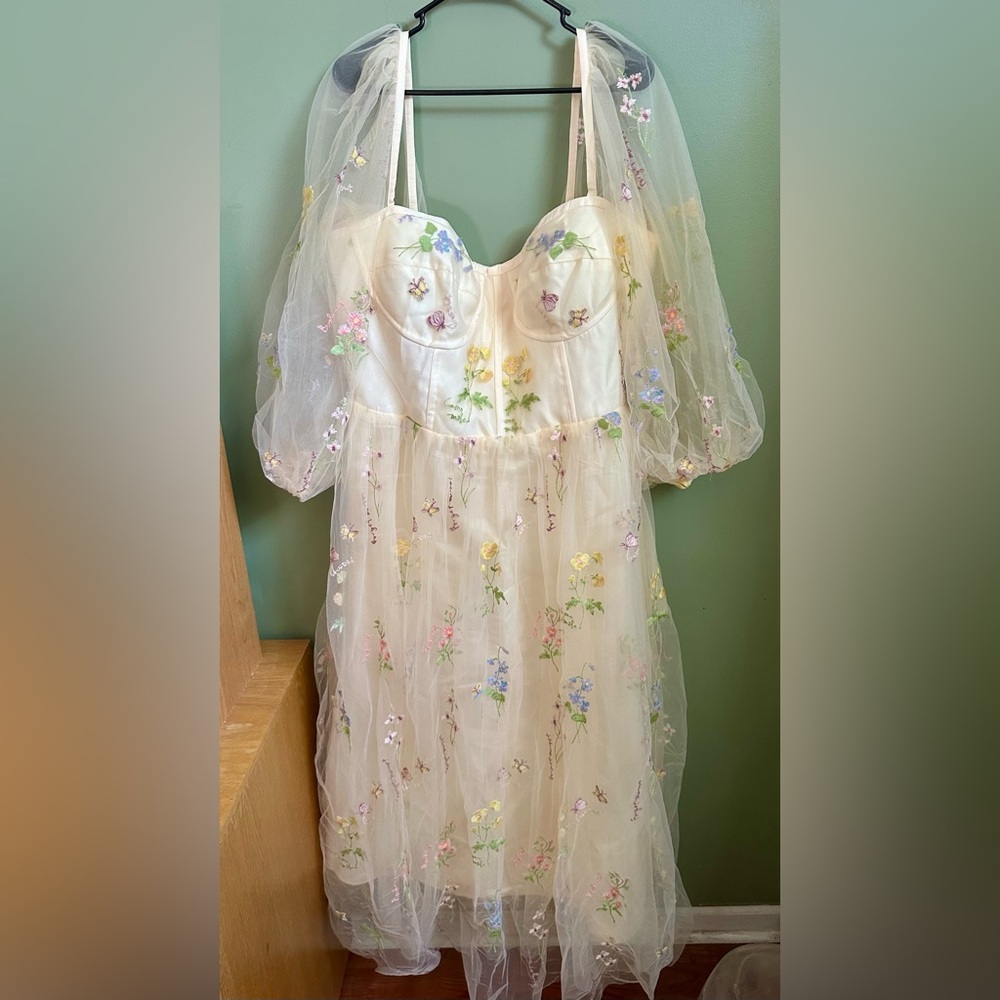 Off- white tulle dress with floral and butterfly embroidery